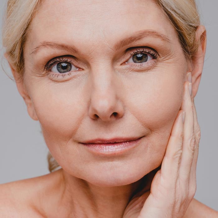 woman touching hand to face