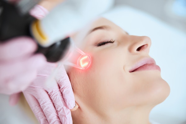 woman receiving laser skin treatment