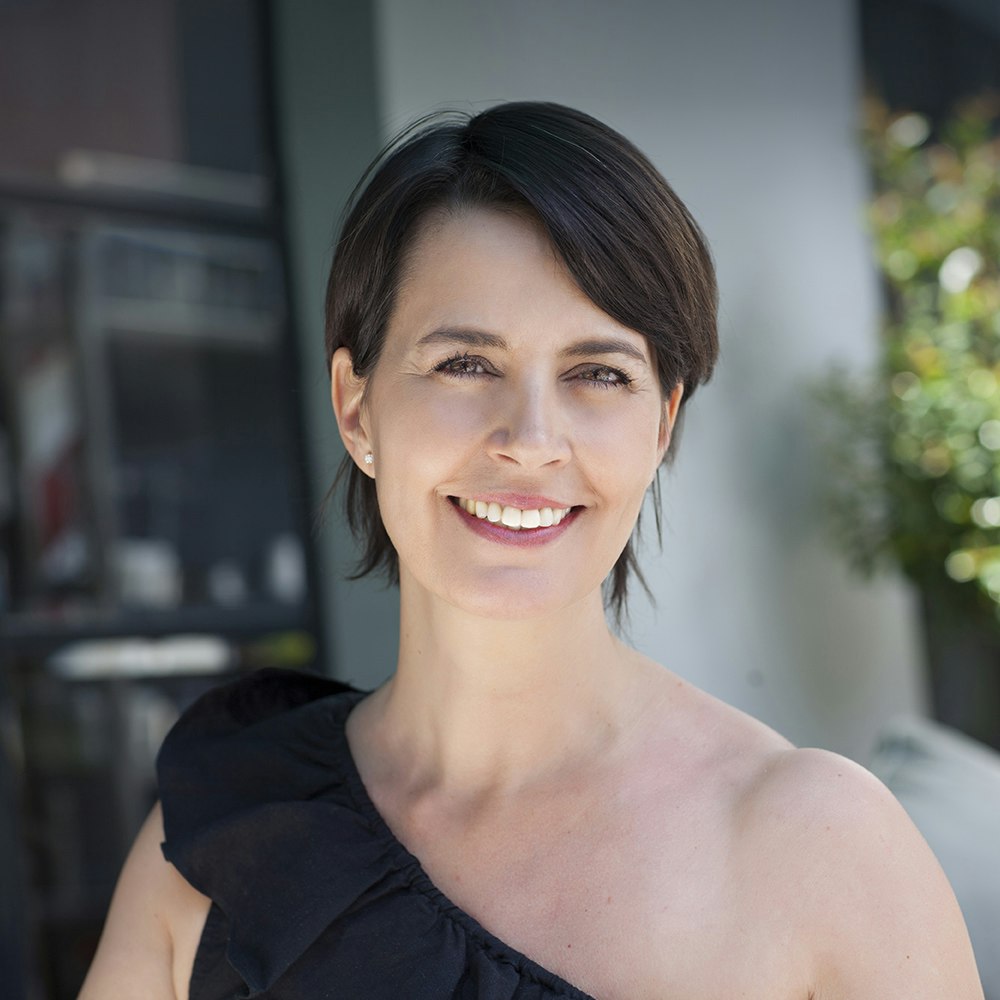 Smiling woman after JUVÉDERM treatment