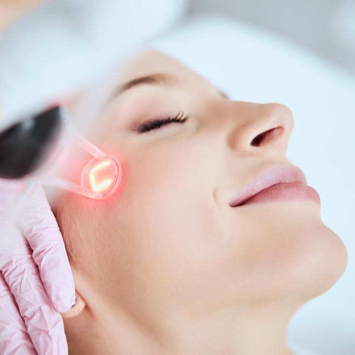 laser on woman's face