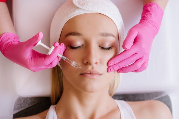 Woman receiving dermal fillers