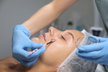 Woman receiving chemical peel