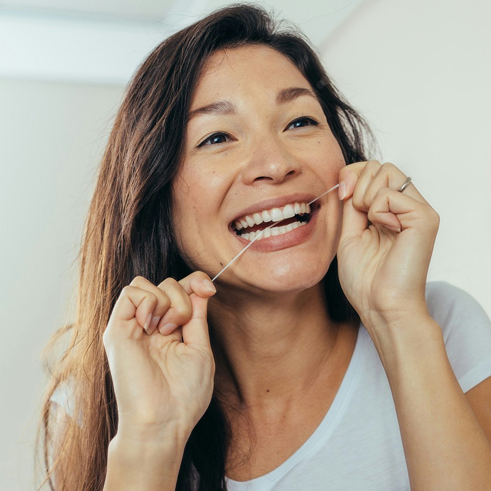 woman flossing