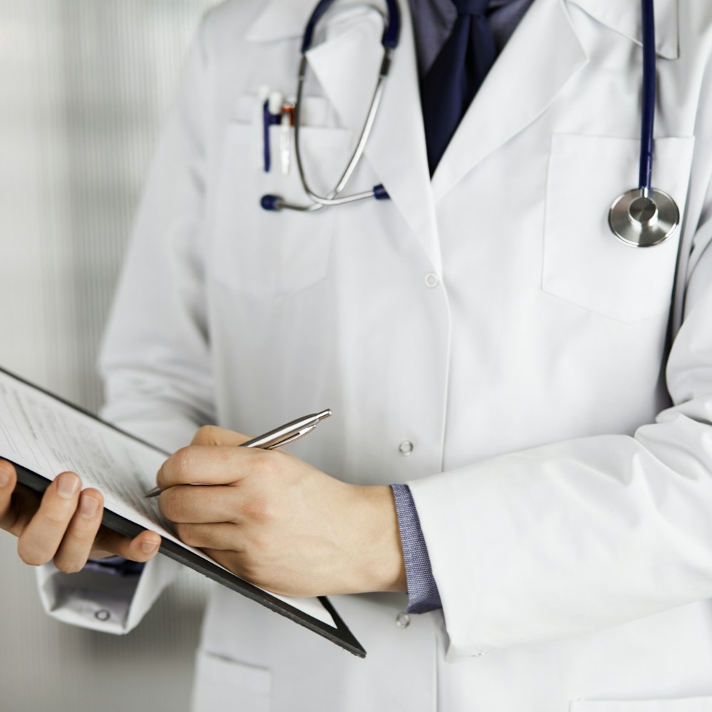 Doctor writing on board