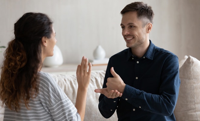 Man and woman using ASL