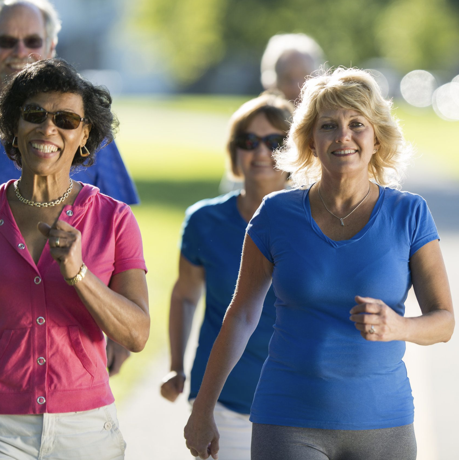 two mature women taking a brisk walk