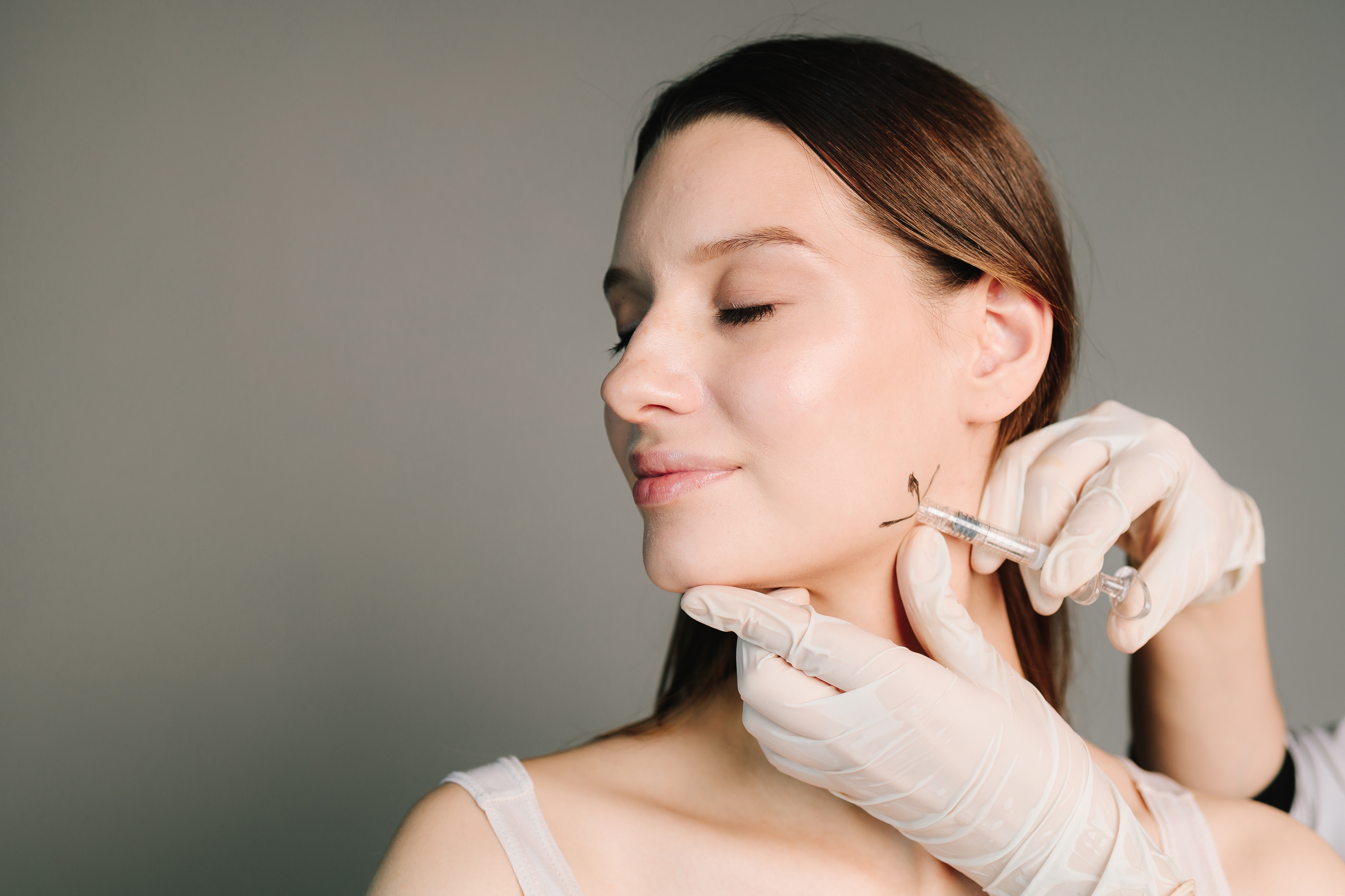 Woman getting a jaw injection