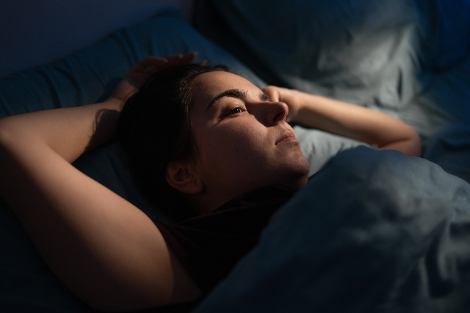 woman lying awake