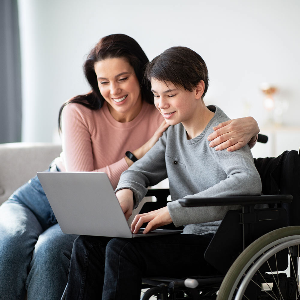 guardian and child using laptop