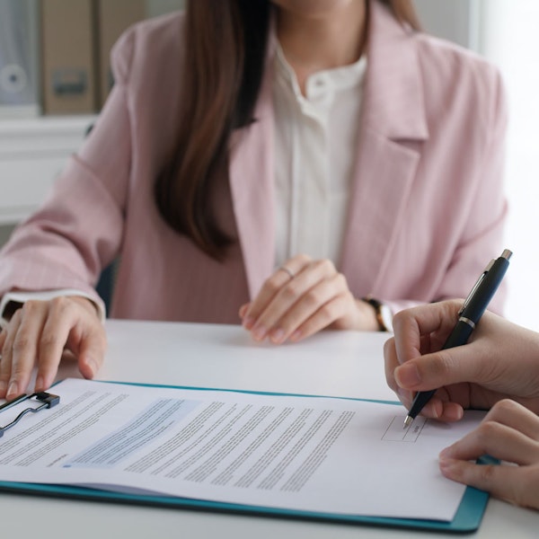 Debra Sutton with client writing a will