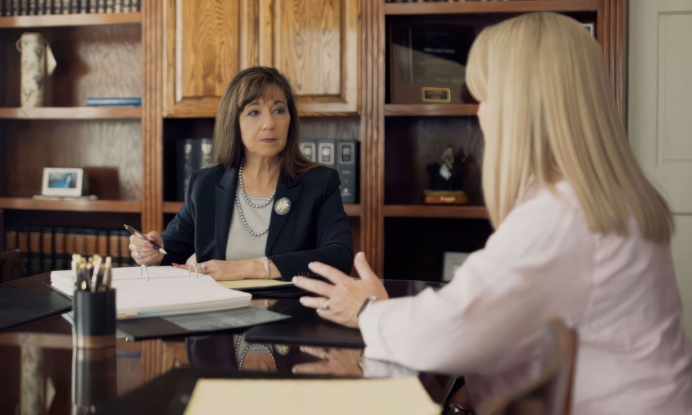 Family law Attorney Debra Sutton speaking with a client