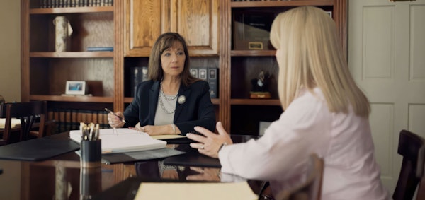 Donna Sutton and client talking