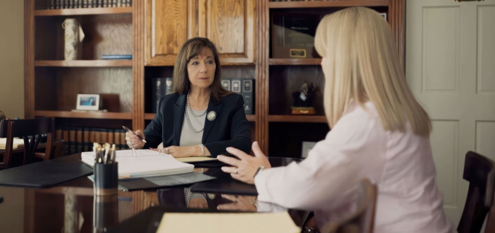 Debra Sutton talking with client