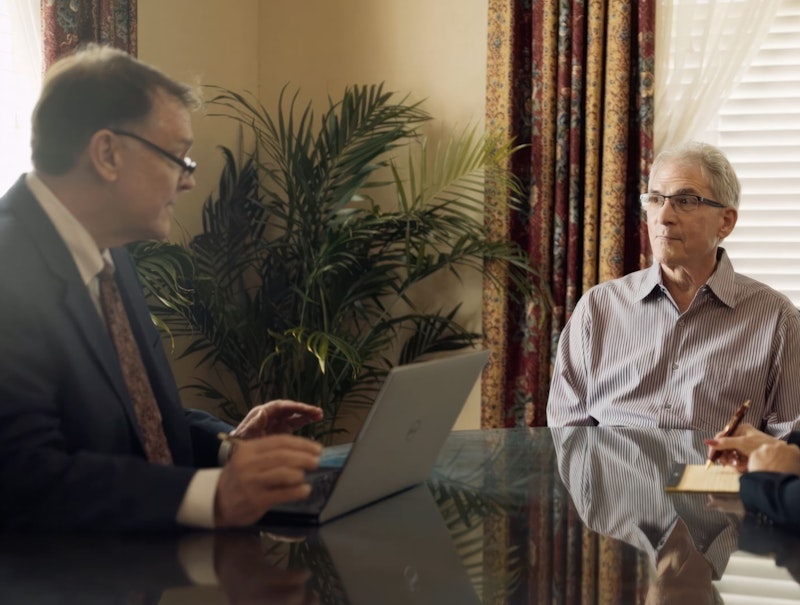 lawyer Matthew J. Kovschak discussing with client