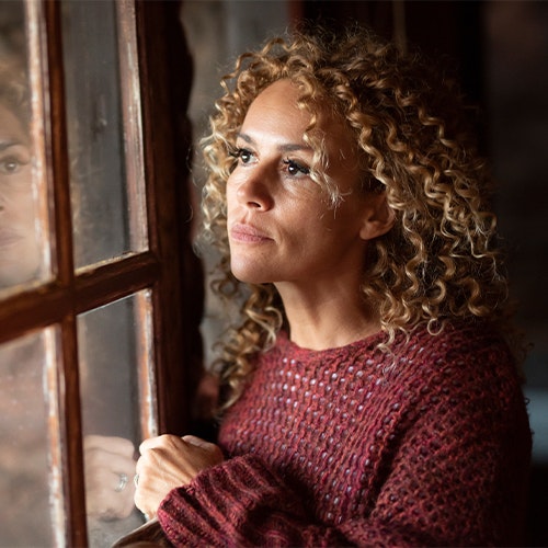 Woman looking out a window