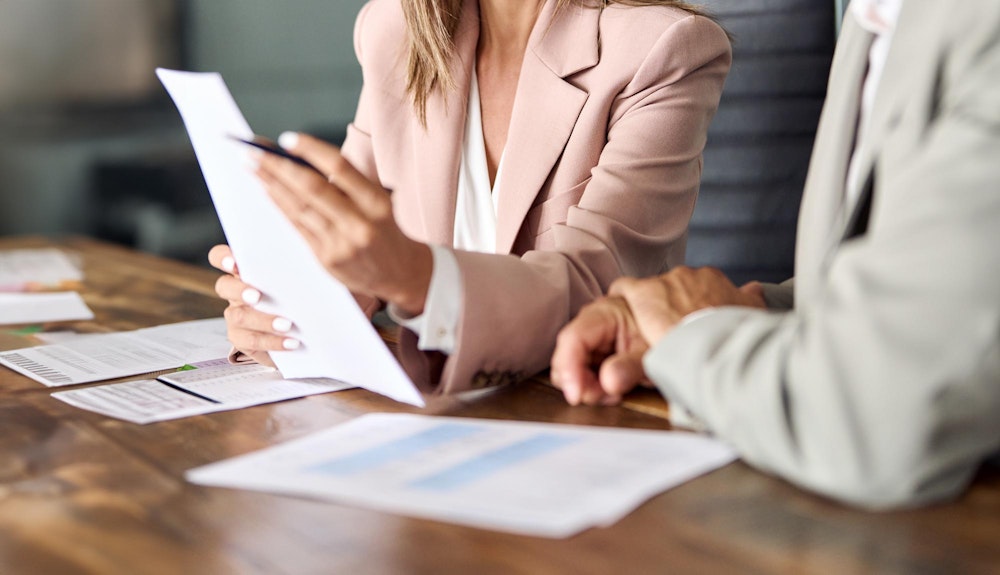 attorney reviewing a will with a client