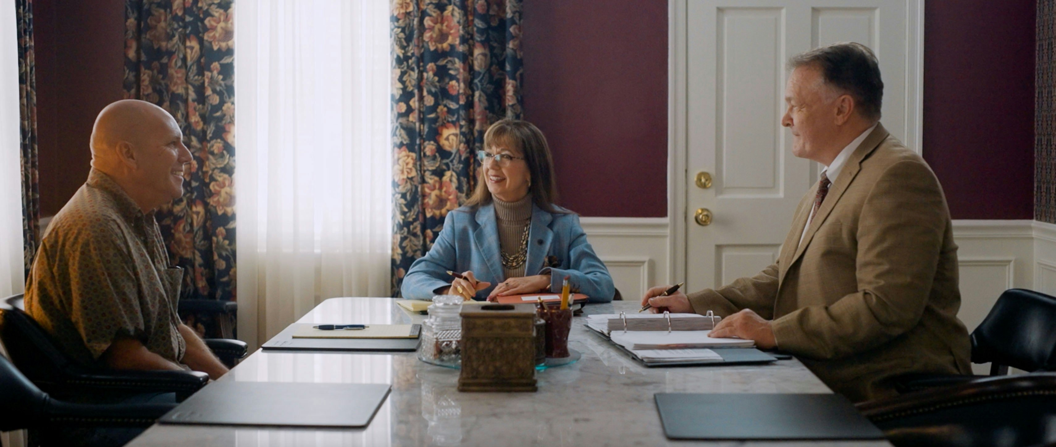 Sutton Law attorneys meeting with a client