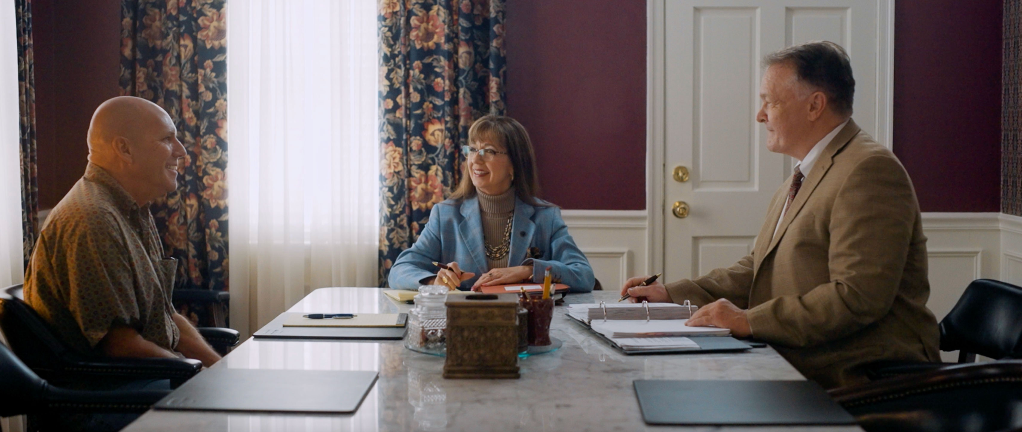 Sutton Law attorneys meeting with a client