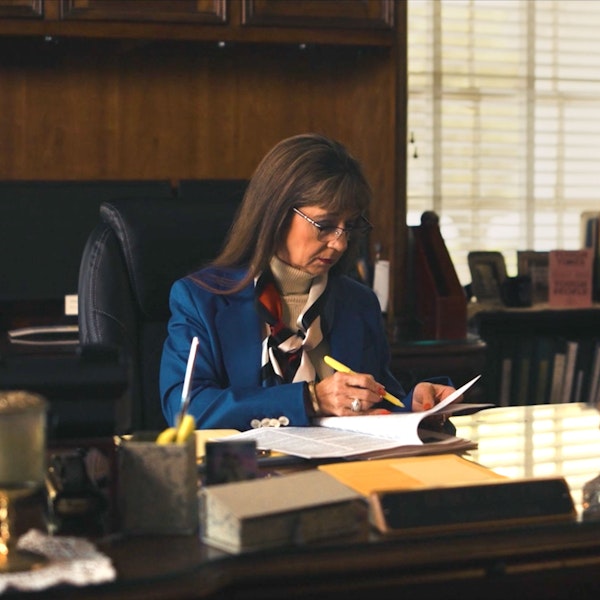 Debra J. Sutton working at her desk