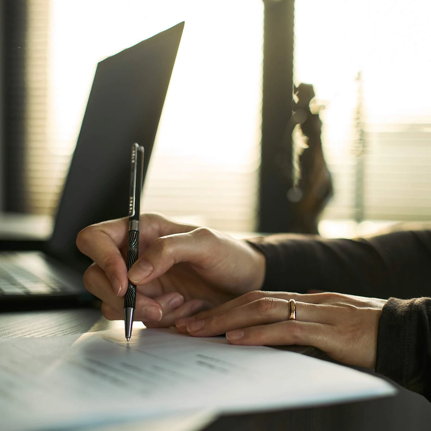 person writing on paper