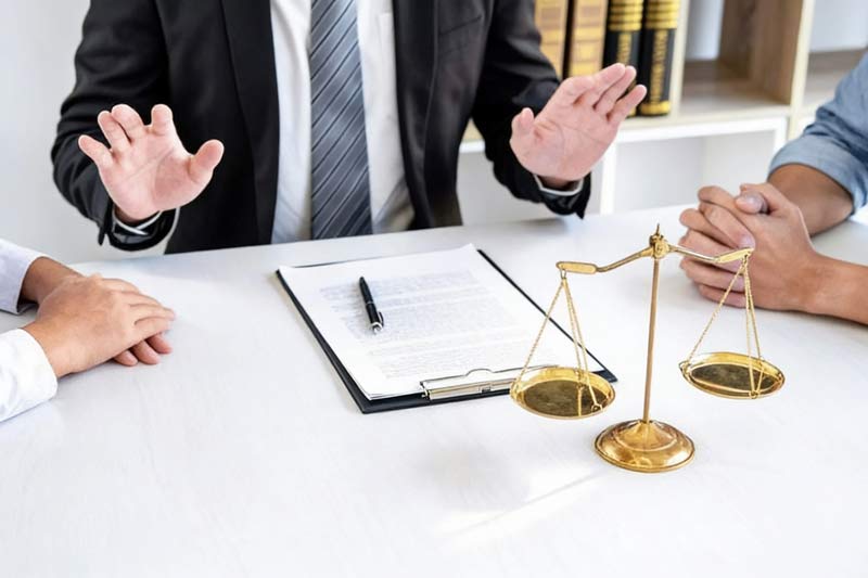 attorney mediating meeting between two people