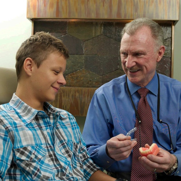 Dr. Norton showing invisalign to patient