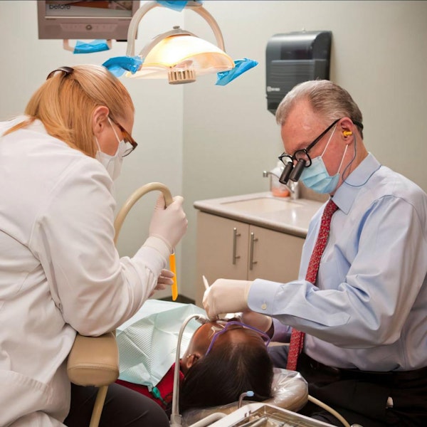 Dr. Norton and hygienist with patient