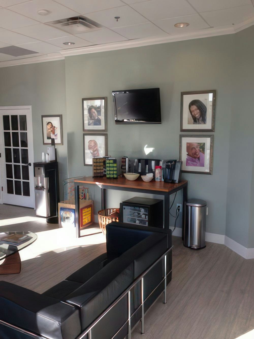 Dental lobby couch and photos