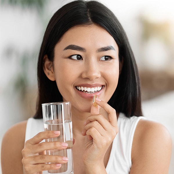Woman taking pill