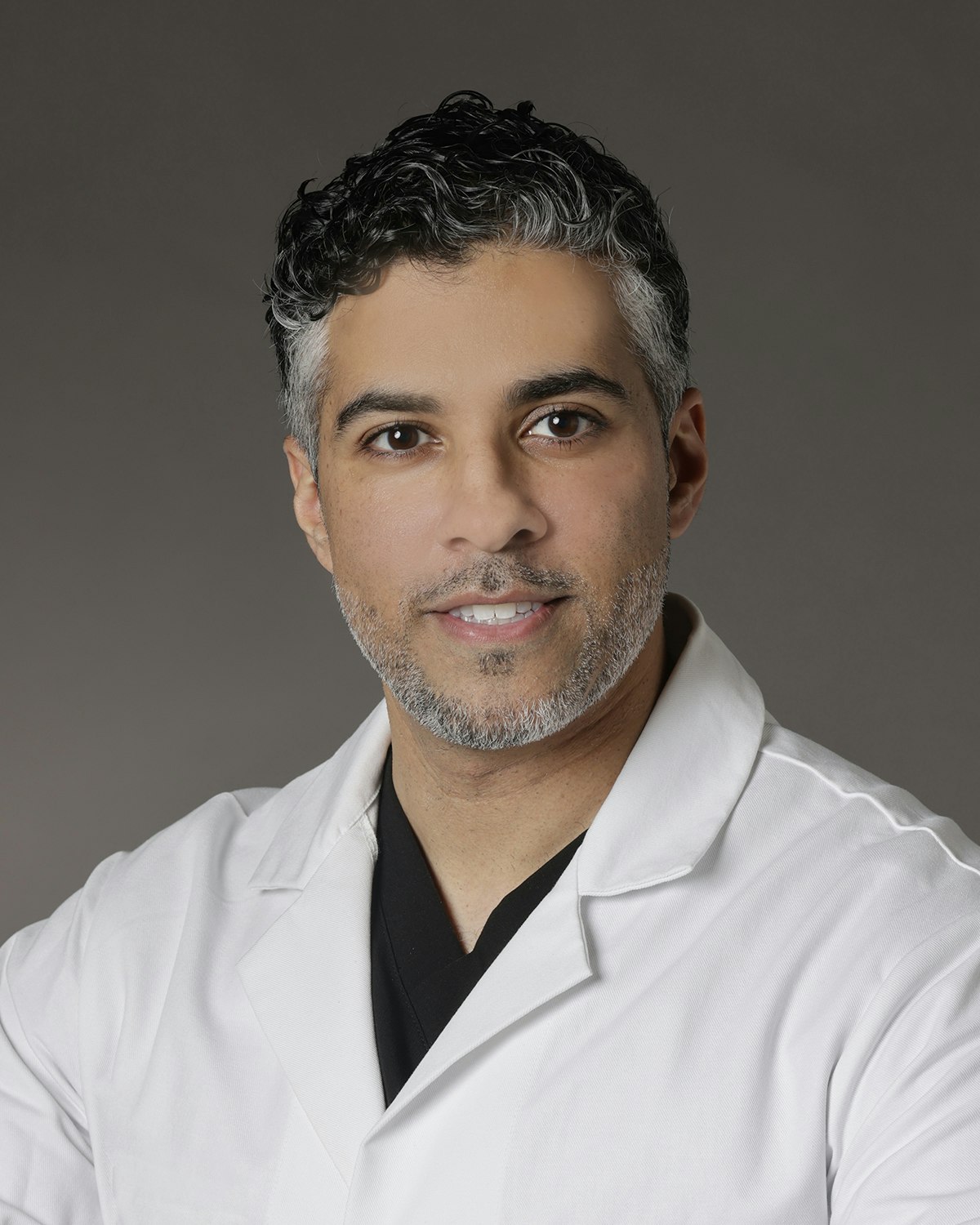 headshot of our hair restoration surgeon, Dr. Syed Quadri