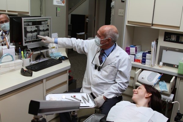 Dr. Scharf having a dental consultation