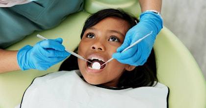 Young girl at the dentist