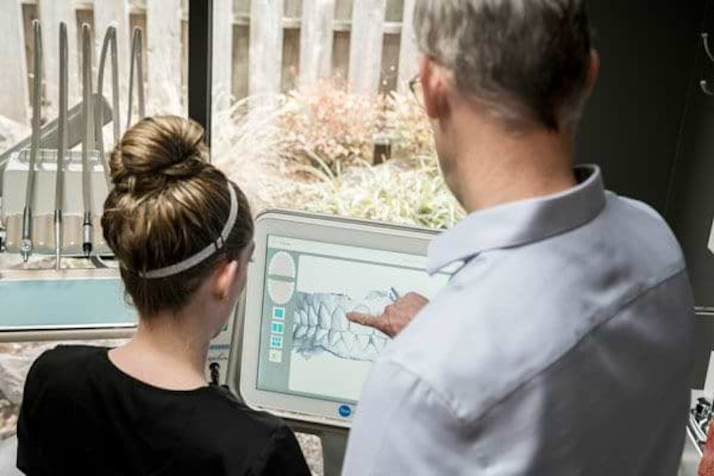 staff viewing itero scanner