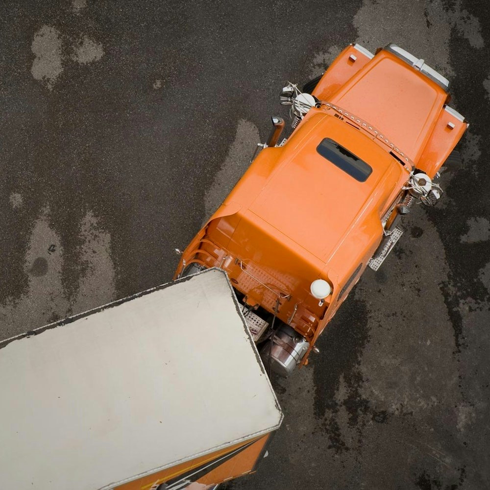 Overhead view of a jackknifed semi truck
