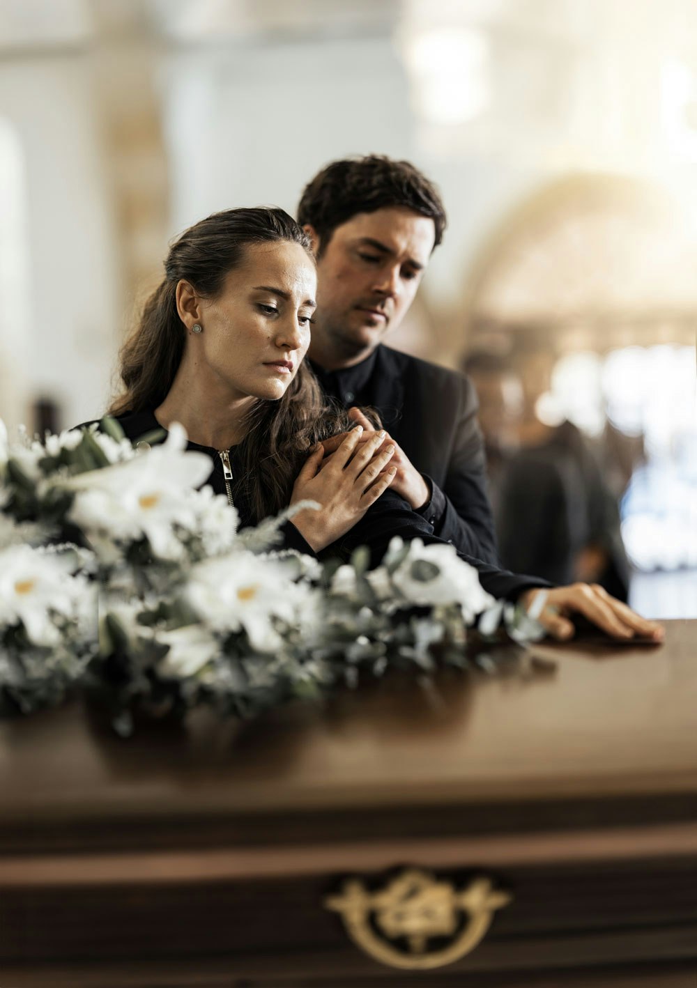Grieving widow at a funeral