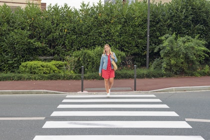 Woman crossing the crosswalk