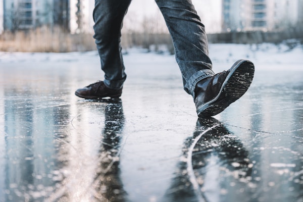 Boots sliding on icy ground