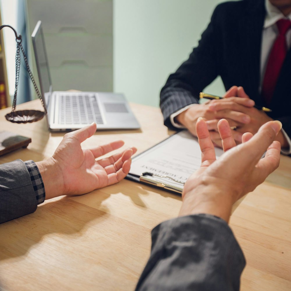 Two people at a desk during consultation