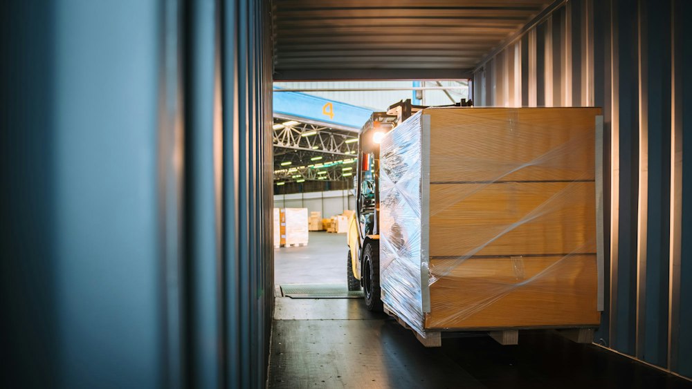 Forklift with pallet of cargo
