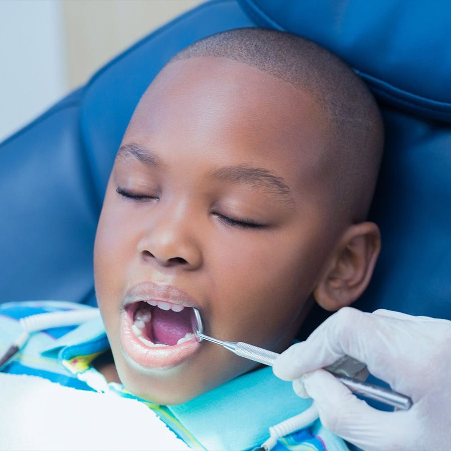 Child receiving dental exam