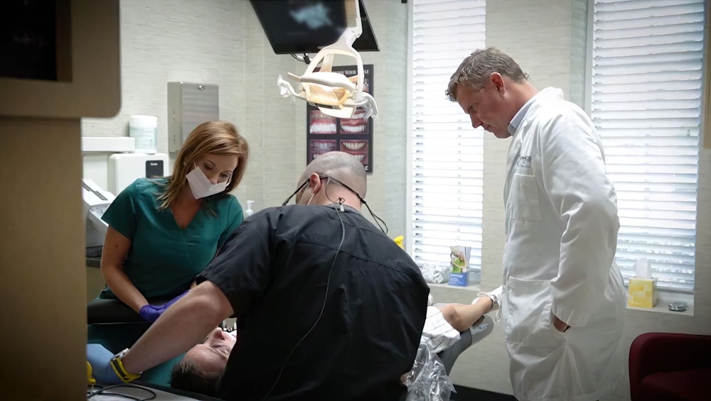 Dentists examining teeth
