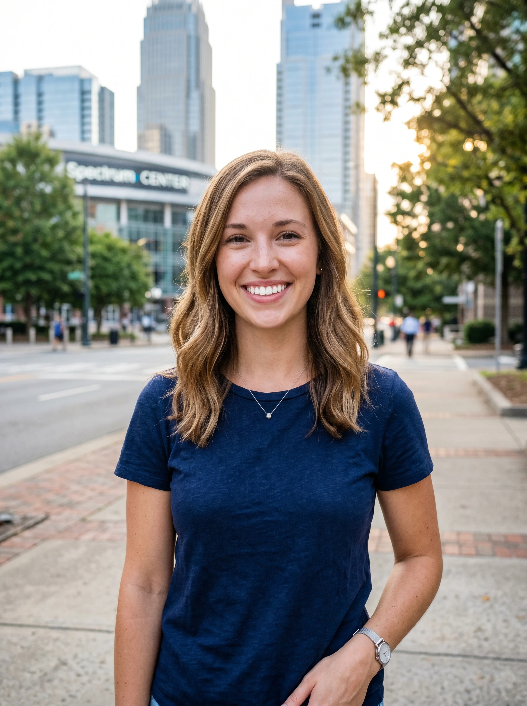 woman smiling in front of the spectrum center