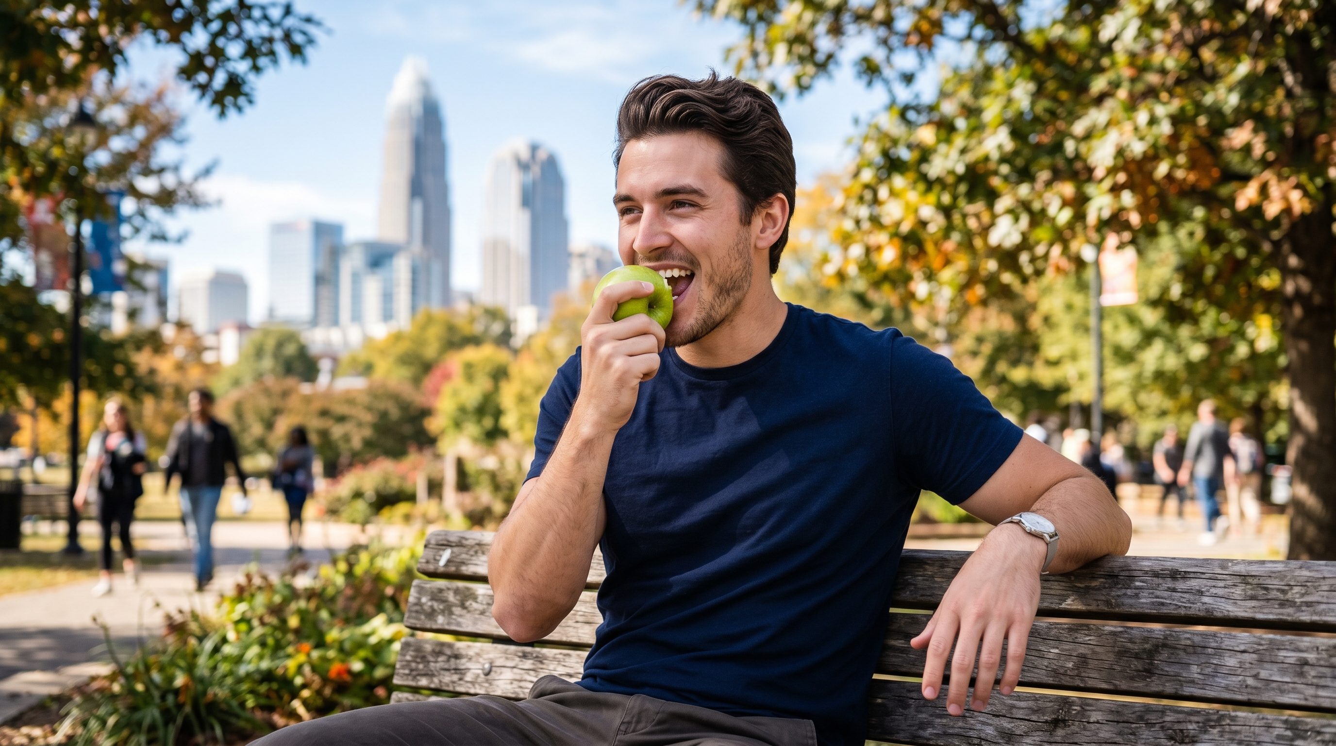 Man eating an apple outdoors in Charlotte NC
