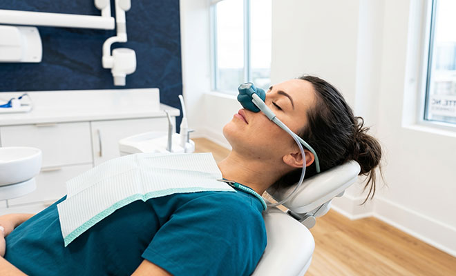 Woman receiving sedation at dentist