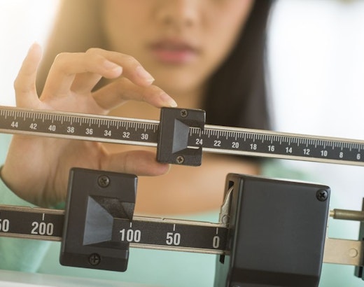 woman weighing herself