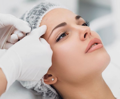 Woman receiving thread lift