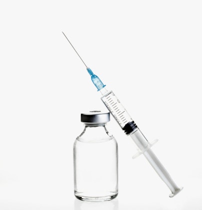 a clear vial and a syringe