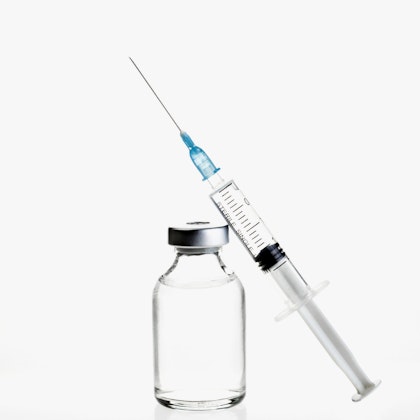 a clear vial and a syringe