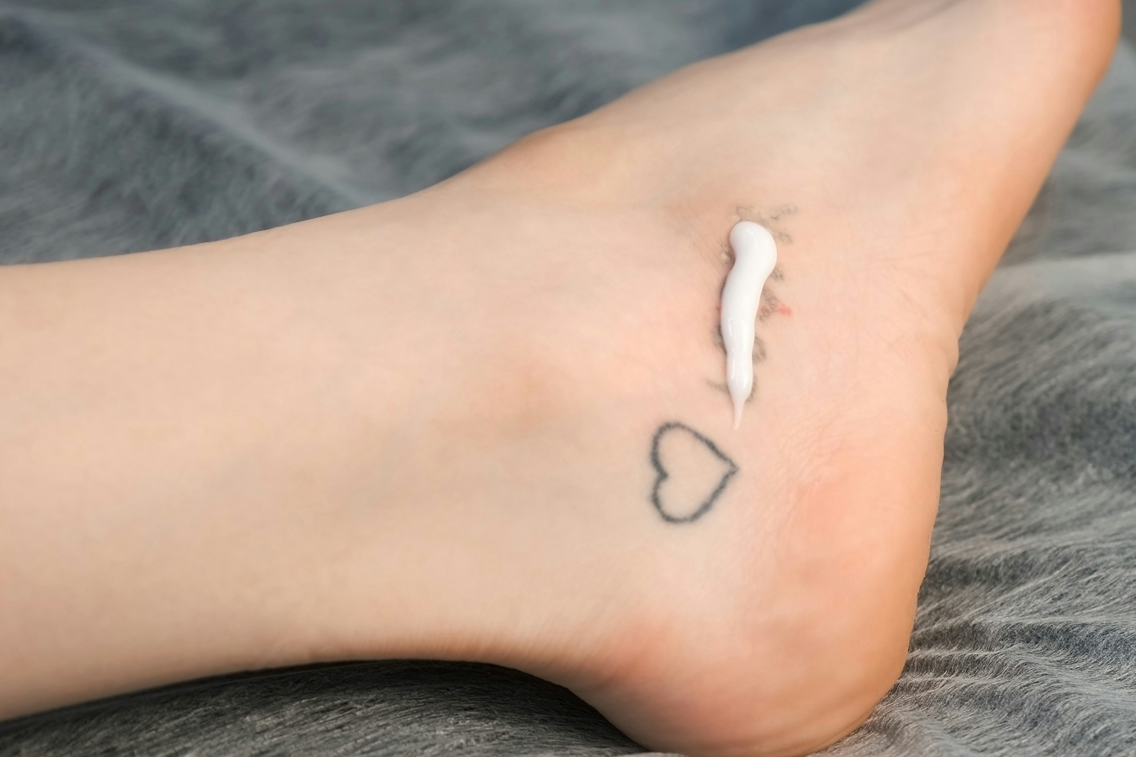 woman tattoo removal cream lotion