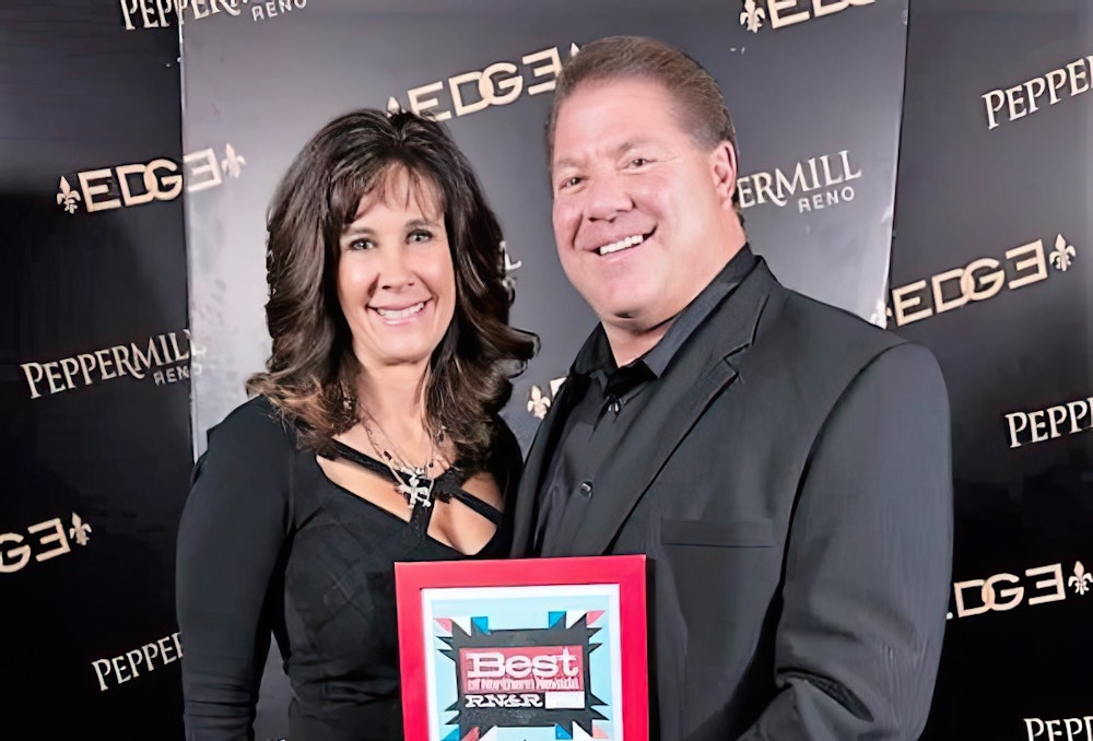 Dr. Murphy and his wife holding a